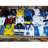 A job lot of 14 football shirts, 4 pairs of shorts and two pairs of socks as illustrated,