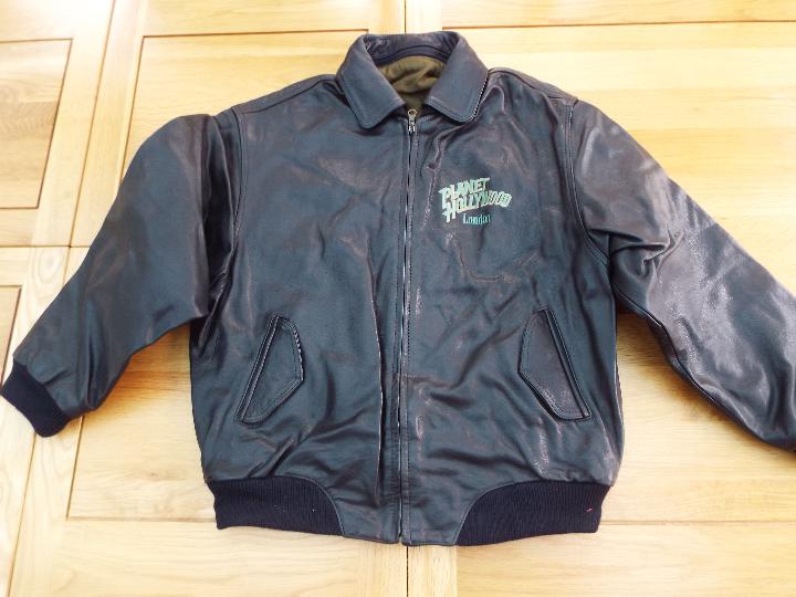 Jacket - a black zip front Jacket, size
