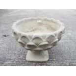 Garden Stoneware - A reconstituted stone pineapple pattern planter on circular base.