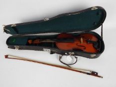 A cased violin and bow, no internal makers label.