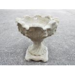 Garden Stoneware - A reconstituted stone urn of tulip form on hexagonal base