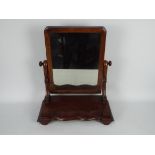 A mahogany vanity mirror,