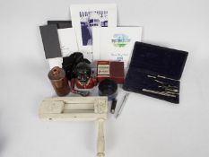 Lot to include Concorde souvenir flight pack, cast aluminium money bank, penknife,