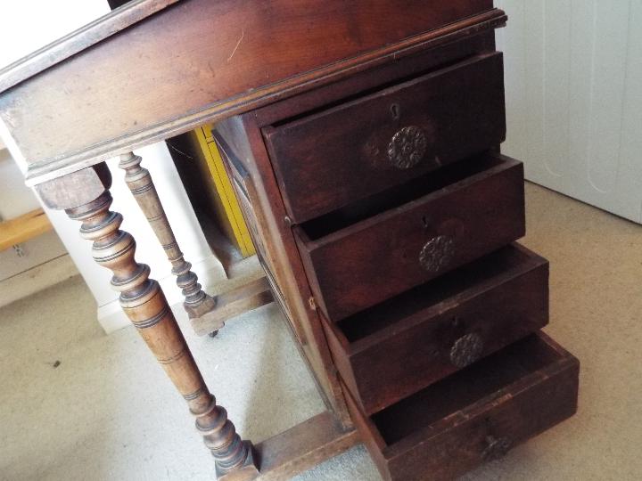 A Victorian davenport with cupboard to the side enclosing four drawers, brass castors, - Image 3 of 7