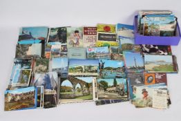 Postcards, a box of unsorted postcards,