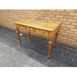 A Victorian mahogany hall table on taper