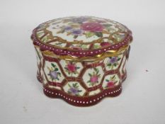 A Chinese pot and cover with floral deco