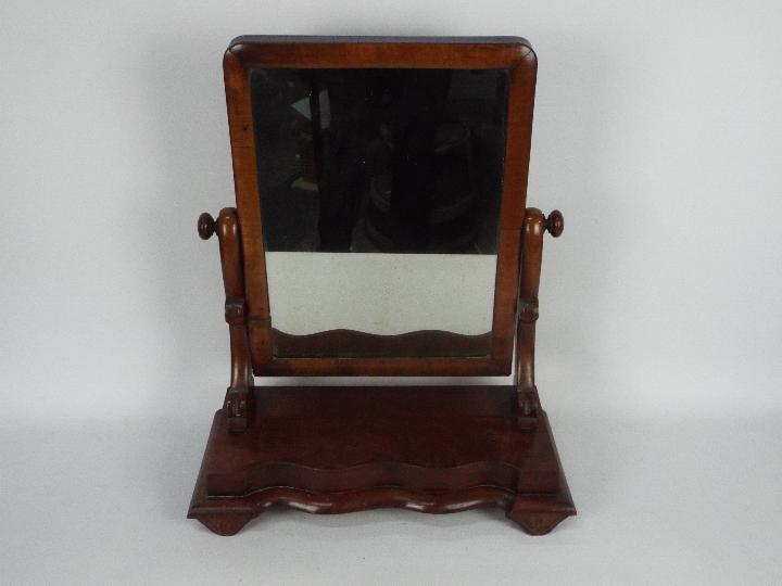 A mahogany vanity mirror, 58 cm (h)