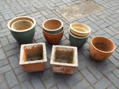 A collection of garden planters of varying size.