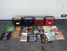 Four cases of 12" vinyl records to include country, compilations and other.