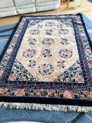A Mongolian, hand knotted, wool rug measuring approximately 244 cm x 168 cm.