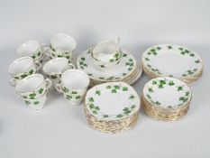 A collection of Colclough China tea wares in the Ivy Leaf pattern, in excess of fifty pieces.