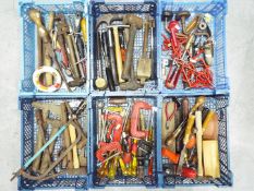 A quantity of mixed hand tools including saws, hammers, screwdrivers, clamps and other.