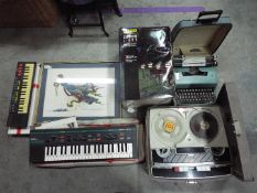 Lot to include a vintage Stella reel to reel recorder, two portable keyboards, boxed garden lights,
