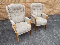 Two Cotswold Chair Company armchairs.