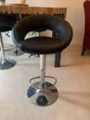 Four black and chrome, height adjustable breakfast / bar stools.