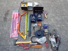 Mixed tools to include jigsaw, vice, pry bars, saws and similar.