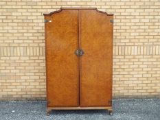 A twin door wardrobe by Heirloom Furniture measuring approximately 200 cm x 123 cm x 58 cm.