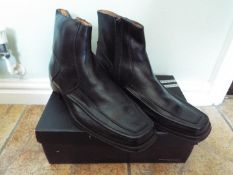 A pair of black leather ankle boots, size 42 (EU), 8 (UK),