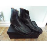 A pair of black leather ankle boots, size 42 (EU), 8 (UK),