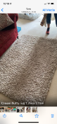 A modern cream rug measuring approximately 170 cm x 115 cm.