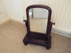 A mahogany vanity mirror,