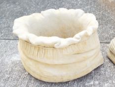 Garden Stoneware - a large reconstituted stone planter in the form of a potato sack,