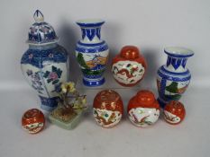 A group of Chinese ceramics to include ginger jars and covers, vases and similar,