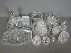 A collection of cut glass table wares to include bowls, vases,