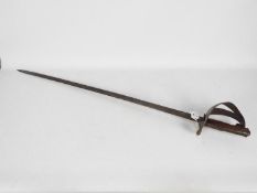 An Italian model 1871/1909 cavalry trooper's sword with 91 cm pipe back blade.