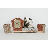 A French Art Deco styled clock garniture comprising of a sculpture of a seated figurine of a lady