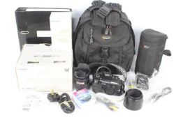 Photography - A boxed Olympus E300 kit with additional lens, camera bag, filters and similar.