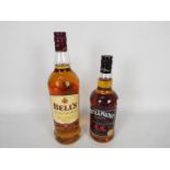 A 75cl bottle of Whyte & Mackay Special and a 1l bottle of Bells, both 40% ABV.