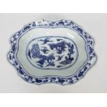 A Chinese blue and white dish decorated with phoenix amongst cloud scrolls,