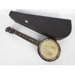 A vintage banjolele in carry case.