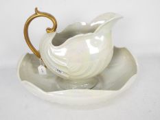Shelley - An iridescent shell form washbowl and jug.