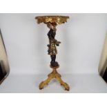 A continental blackamoor pedestal, carved pine with gesso and polychrome finish,