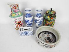 A collection of Chinese ceramics to include pair of blue and white vases, jar and cover and similar.