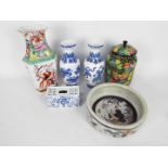 A collection of Chinese ceramics to include pair of blue and white vases, jar and cover and similar.