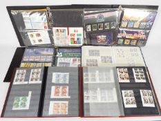 Philately - A collection of mint stamps, presentation packs and partial sheets,