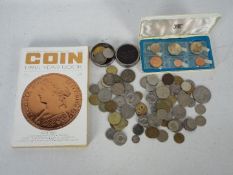 A collection of predominantly foreign coins with a small quantity of UK with a 1971 Isle Of Man
