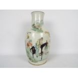 Chinese vase decorated to one side with calligraphy,