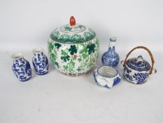 A collection of Oriental ceramics, predominantly blue and white, largest approximately 20 cm (h).
