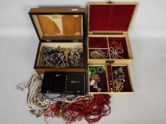 A quantity of various costume jewellery including bracelets, necklaces, brooches and similar.