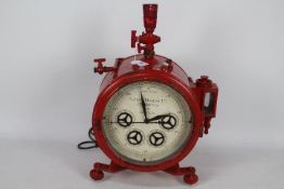 An antique Alder & Mackay Ltd gas meter gauge converted to a clock and lamp.