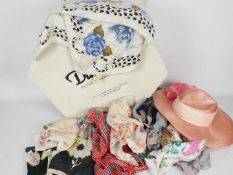 A hat box containing a lady's Philip Somerville hat and a collection of silk scarves to include