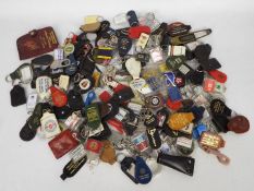 A large collection of various keyrings.