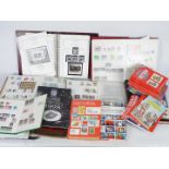 Philately - A collection of stamp albums containing used and mint stamps,