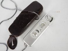 A vintage subminiature camera by Minox, with Complan 1:3,5 15mm lens, with leather case.