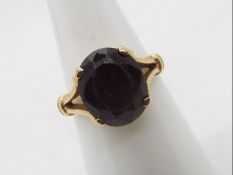 A 9ct gold and garnet ring, size M, approximately 3.7 grams.